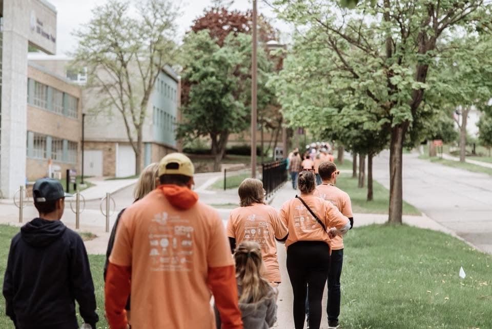 Walkers on a tree-lined path at the Wausau Walk of Hope